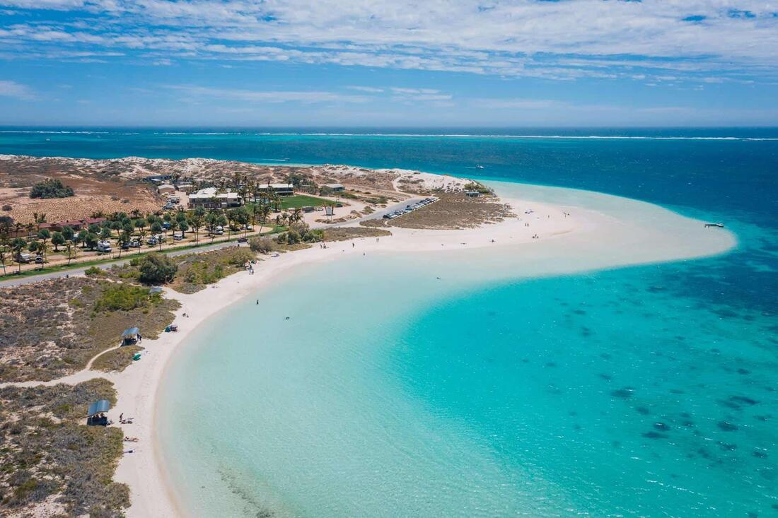 Aerial view of Coral Bay and Ningaloo Reef's crystal-clear turquoise waters in Western Australia